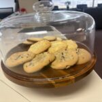 plate of chocolate chip cookies under glass